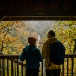 Couple looking out at a waterfall 
